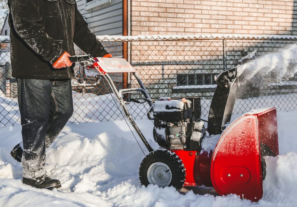 red and black ride on toy car on snow covered ground